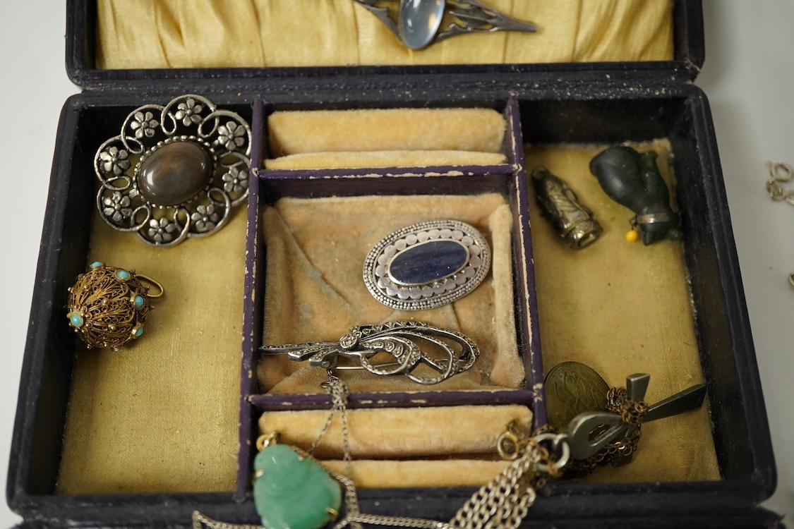A group of mainly silver and white metal costume jewellery, including a moonstone set brooch, 53mm, a filigree gilt metal and enamel fob and marcasite set bracelet etc.